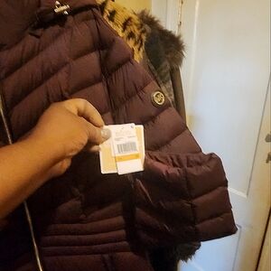 Brand new  Michael kors coat 3x new with the tag never worn. 3/4 Length 38 Inch